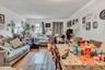 Living area with a textured ceiling and wood finished floors