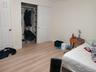 Bedroom with light wood-type flooring and a closet