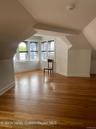 Additional living space with lofted ceiling and light wood-type flooring
