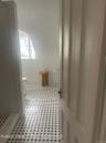 Bathroom with toilet and tiled shower
