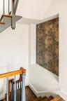Staircase featuring wood finished floors and baseboards