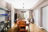 Dining area featuring beverage cooler, light wood-style flooring, and a chandelier