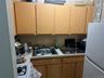 Kitchen featuring white appliances and light countertops