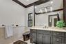 Primary Bathroom #2 with vanity, tile walls, a wainscoted wall, crown molding, and recessed lighting