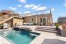 Rear view of property with a rooftop deck, an outdoor hangout area, and stairway