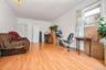 Workout room with light wood-style floors and baseboards