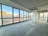 Unfurnished sunroom with a view of city