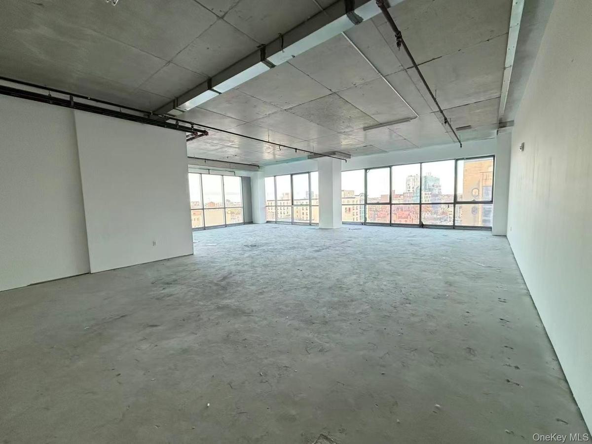 Spare room featuring concrete flooring