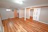 Basement featuring light wood-style floors