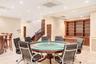 Rec room featuring recessed lighting, wainscoting, and a decorative wall