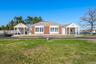 Bungalow-style home featuring brick siding and covered porch