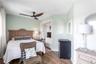 Bedroom with wood finished floors, a ceiling fan, and recessed lighting