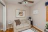 Living room with wood finished floors and ceiling fan