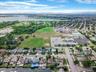 View of property location with a large body of water and nearby suburban area