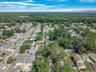 Aerial view of property's location with nearby suburban area