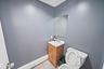 Half bath featuring tile patterned floors and vanity