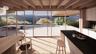 Sunroom / solarium featuring beam ceiling and a mountain view