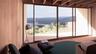 Entryway featuring wood walls, healthy amount of natural light, wood finished floors, and a water and mountain view