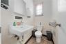 Bathroom featuring tile walls and a wainscoted wall