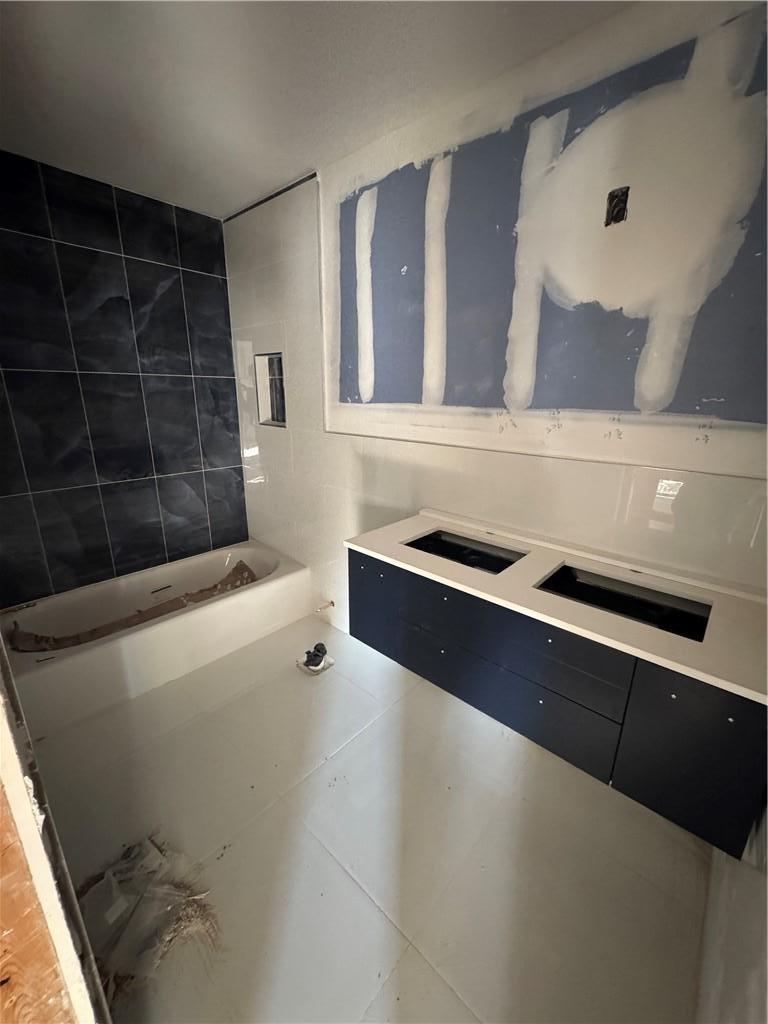 Bathroom featuring tile patterned floors with modern finishings