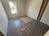 Spare room with dark hardwood / wood-style flooring