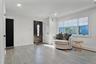 Entrance foyer with wood finished floors, ornamental molding, recessed lighting, and a baseboard heating unit