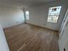 Unfurnished room featuring light wood-style floors and baseboards