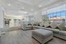 Living room with recessed lighting, wood finished floors, and ornamental molding