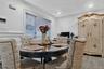Dining room with crown molding and light wood-style floors