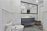 Bathroom featuring double vanity and recessed lighting