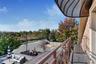Balcony featuring an outdoor living space and view of scattered trees