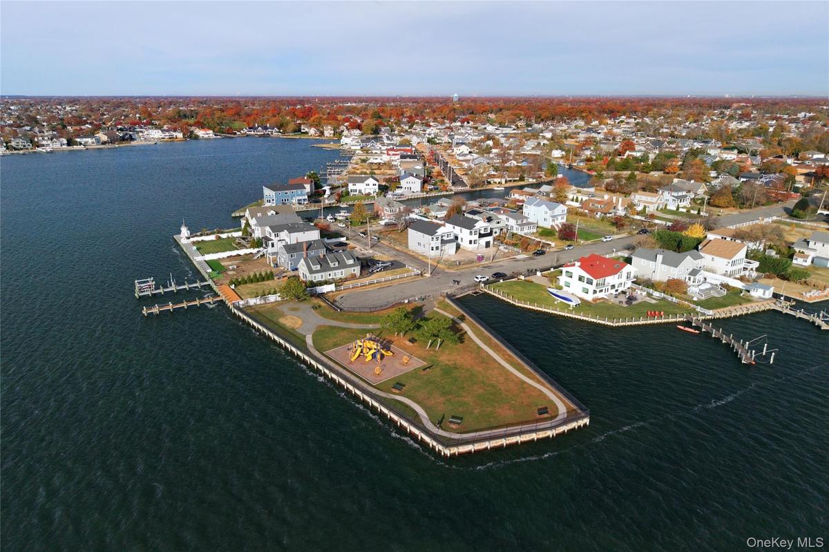 Aerial view of property's location featuring a nearby body of water