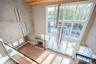 Balcony overlooking great room with expansive windows and plenty of natural light