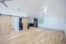 Garage apartment featuring a separate bedroom and full kitchen