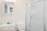 Full bathroom with a shower stall and vanity