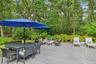 Wooden terrace featuring outdoor lounge area and outdoor dining space