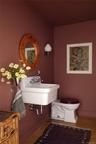 Bathroom with wood finished floors and baseboards