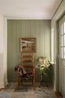 Sitting room with baseboards and stone finish floors