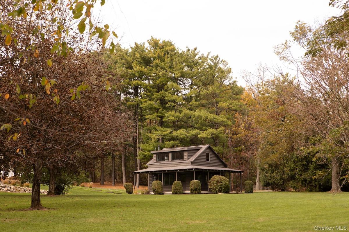 View of home's community featuring a yard and a porch