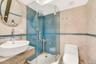 Bathroom with tile walls, a stall shower, and backsplash