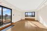 Unfurnished room featuring a tray ceiling, wood-type flooring, and recessed lighting