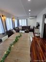 Dining area featuring dark wood-style flooring, recessed lighting, and an AC wall unit