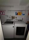 Washroom featuring washing machine and clothes dryer