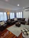 Living room featuring dark wood finished floors, recessed lighting, and a wall mounted air conditioner
