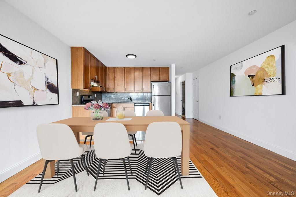 Dining area with baseboards and light wood-style floors
