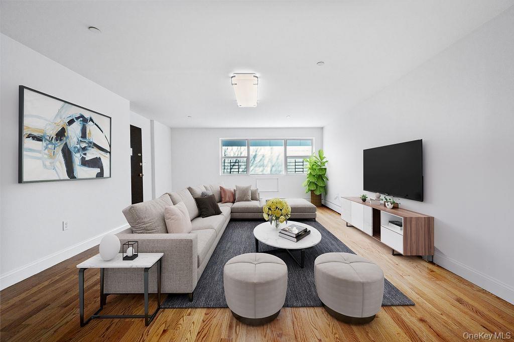 Living room with wood finished floors and baseboards