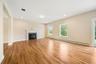 Unfurnished living room featuring light hardwood / wood-style flooring and baseboard heating