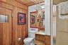 Bathroom with vanity, tile walls, and wooden ceiling