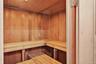 Sauna / steam room with wood ceiling and wood walls