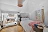Bedroom featuring wood finished floors and lofted ceiling